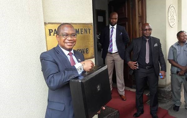 Professor Mthuli Ncube hold briefcase before 2019 Budget presentation